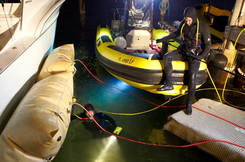 sea tow diving under boat