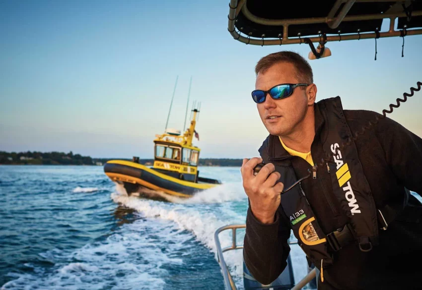 A Sea Tow Captain providing boat towing to a boat in need.