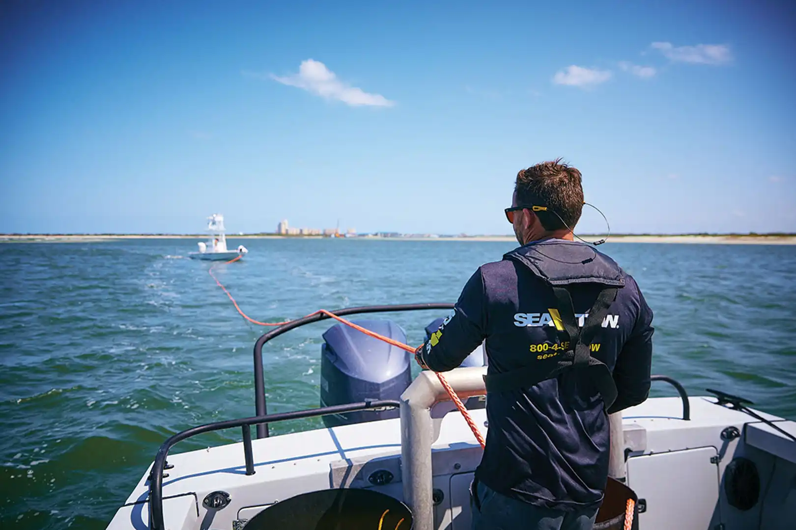 Sea Tow captain pulling towing line during ungrounding on water assistance