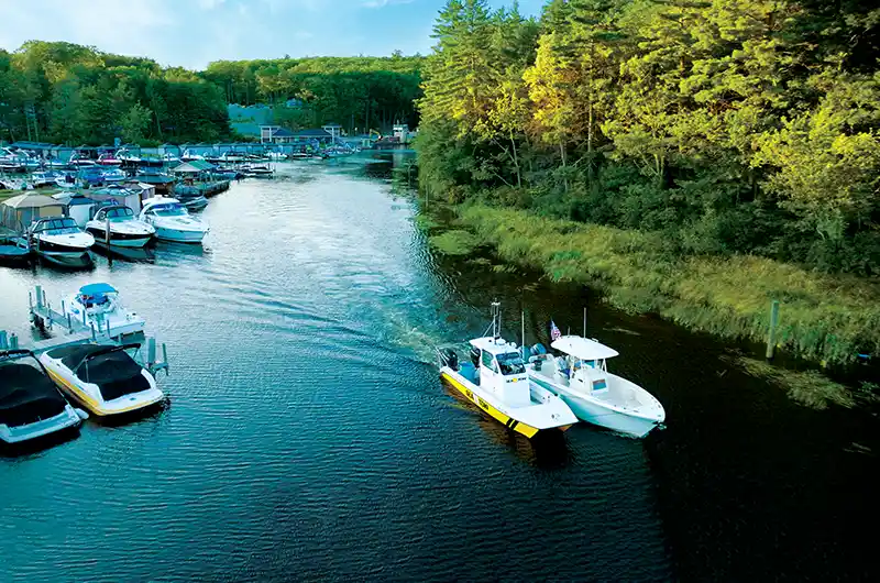 sea tow boat towing member boat on lake